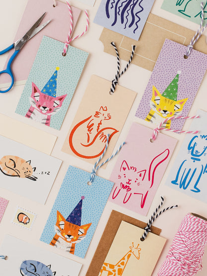Collection of colourful greeting cards with animal illustrations on a light background